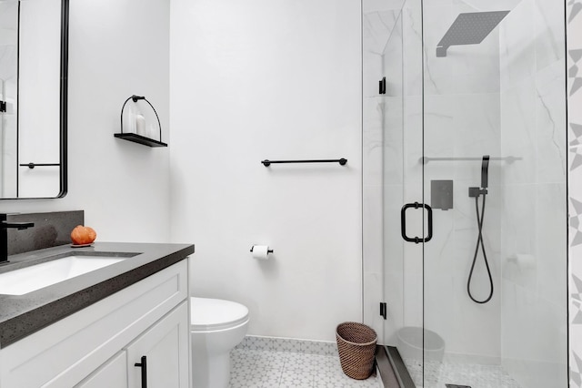 bathroom featuring tile patterned floors, a shower stall, toilet, and vanity