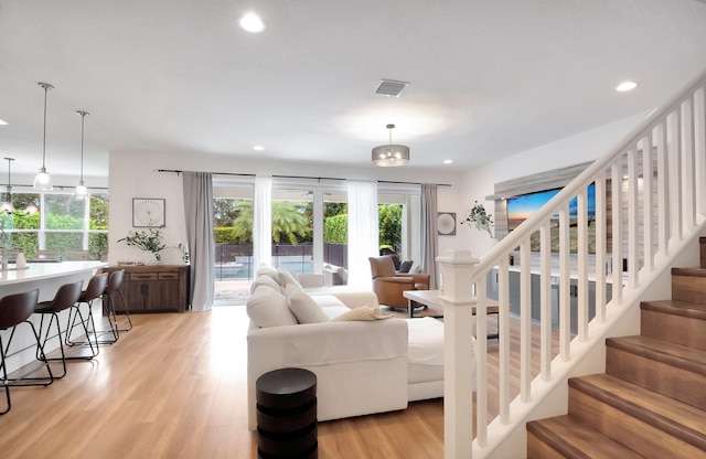 living room with light hardwood / wood-style floors