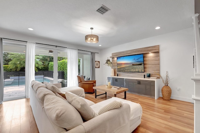 living room with light hardwood / wood-style floors