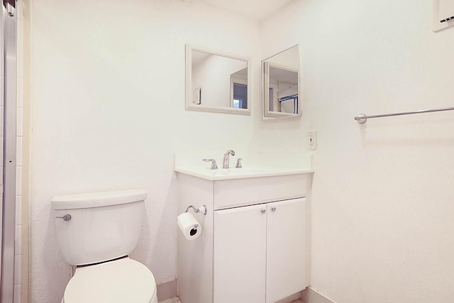 bathroom with toilet and vanity