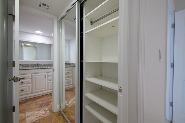 pantry featuring visible vents and a sink