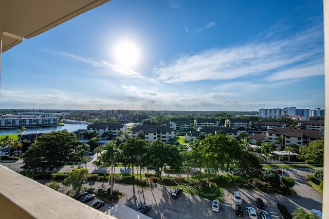 birds eye view of property with a view of city and a water view