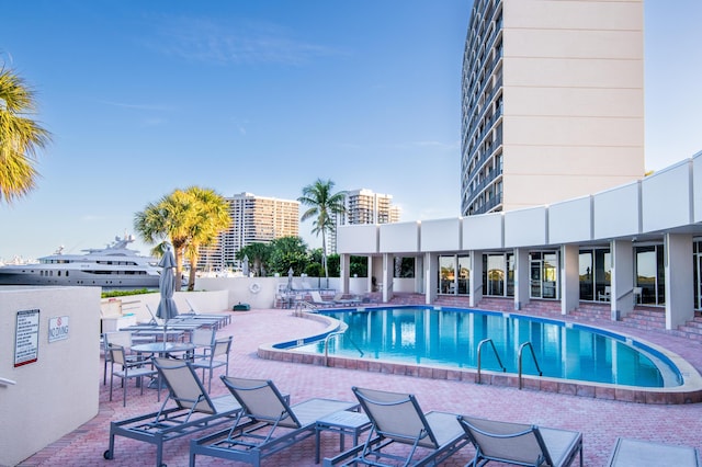 view of swimming pool with a patio area