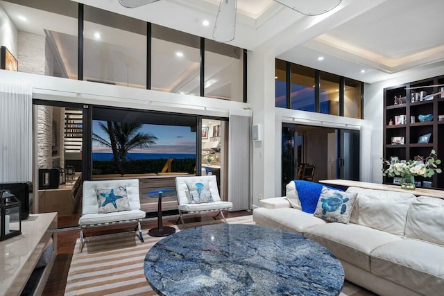 living room featuring a towering ceiling