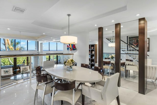 dining space with a tray ceiling