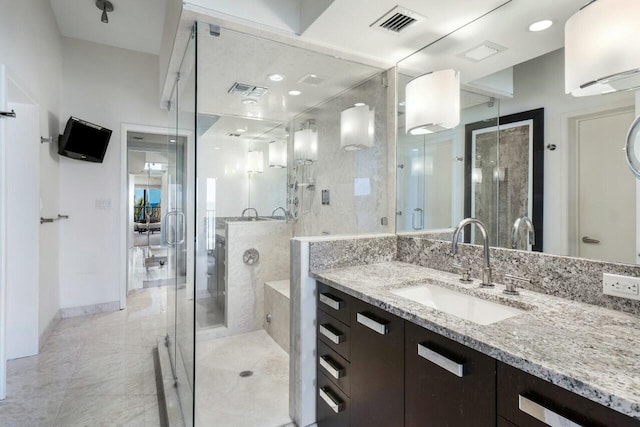 bathroom with vanity and an enclosed shower