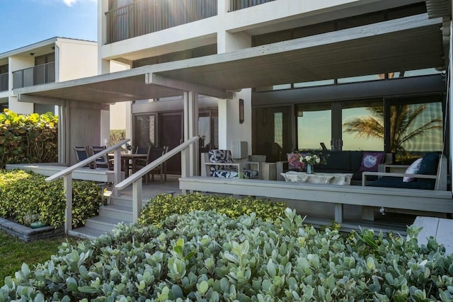 back of house with an outdoor hangout area