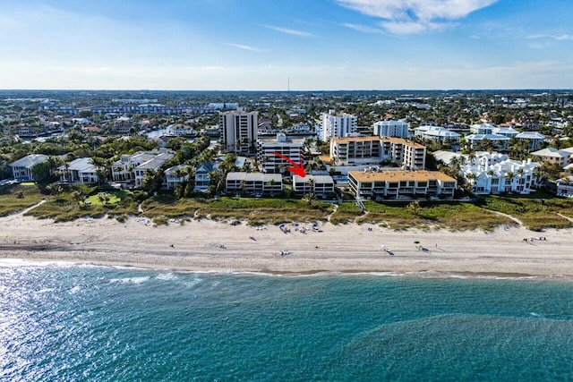 aerial view featuring a view of the beach and a water view