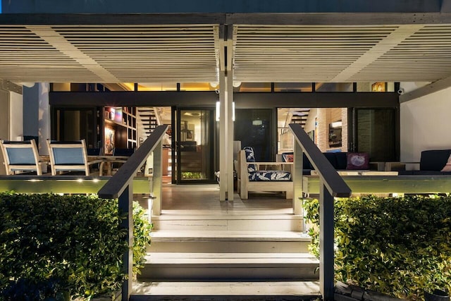 doorway to property with a pergola