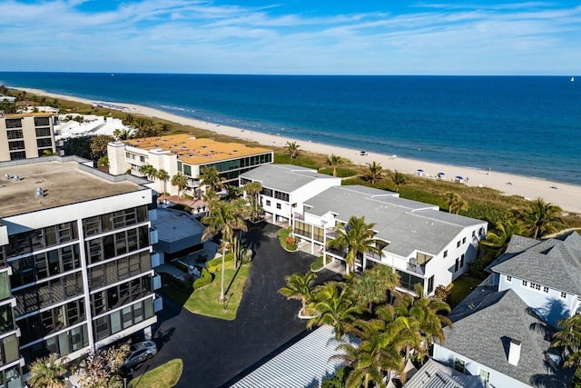 birds eye view of property with a view of the beach and a water view