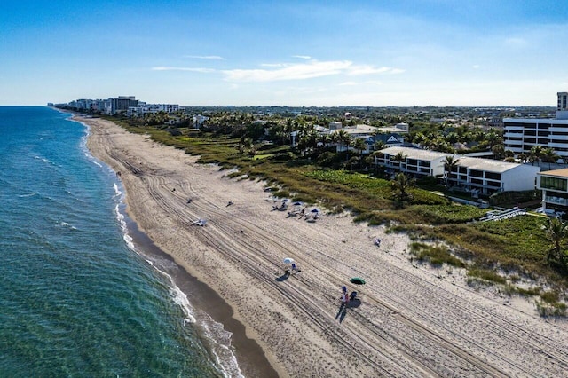 bird's eye view with a view of the beach and a water view