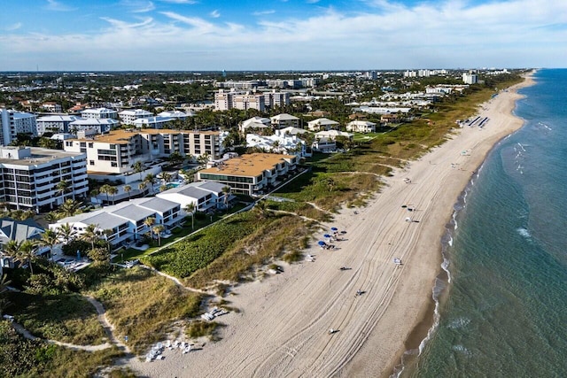 bird's eye view featuring a beach view and a water view