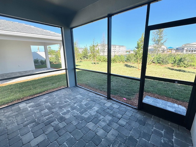 unfurnished sunroom with a residential view