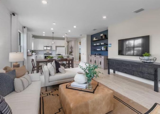 living room with visible vents and recessed lighting