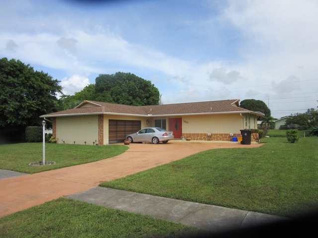 ranch-style home with a front yard and a garage