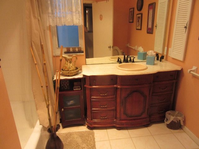 bathroom with tile patterned flooring, shower / tub combo, and vanity