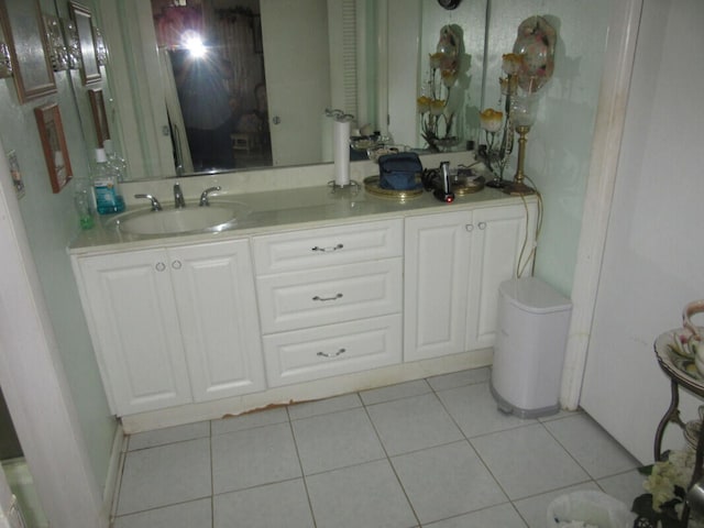 bathroom with tile patterned floors and vanity