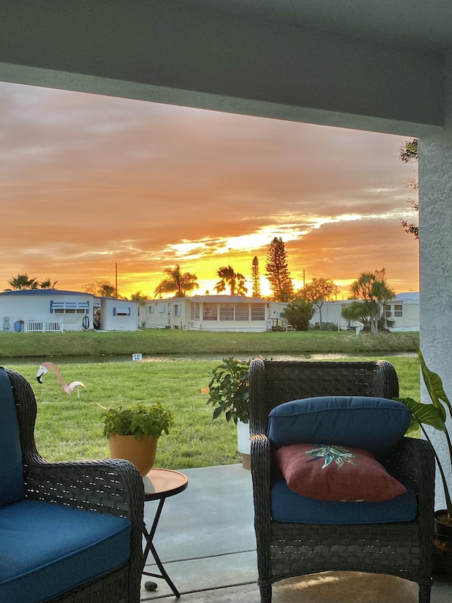 patio terrace at dusk with a lawn