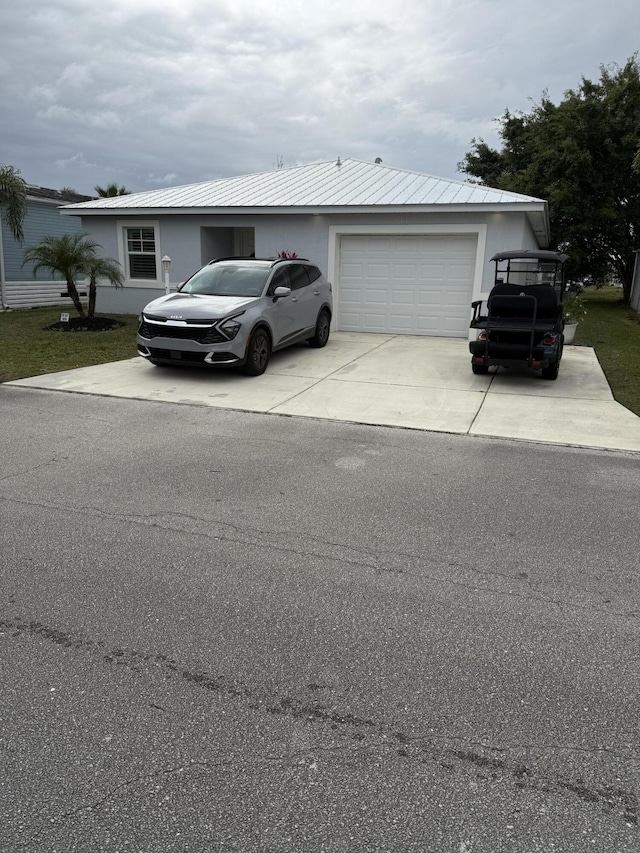 ranch-style house featuring a garage