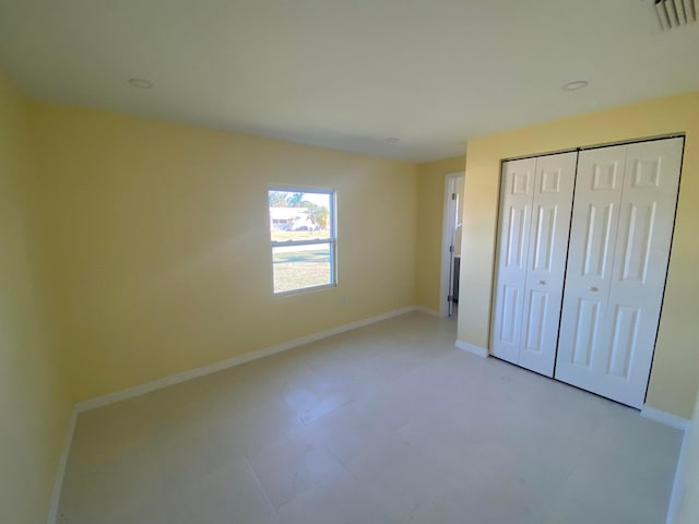 unfurnished bedroom with a closet