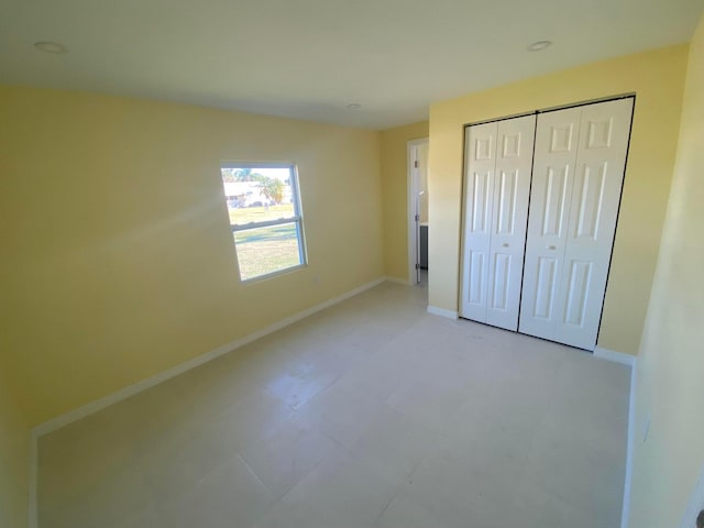 unfurnished bedroom with a closet