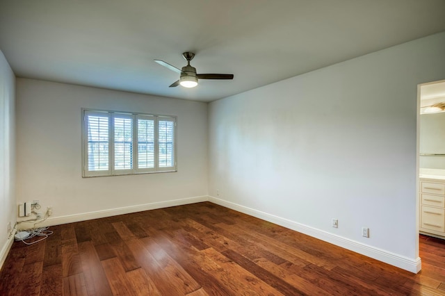 unfurnished room with ceiling fan and dark hardwood / wood-style flooring