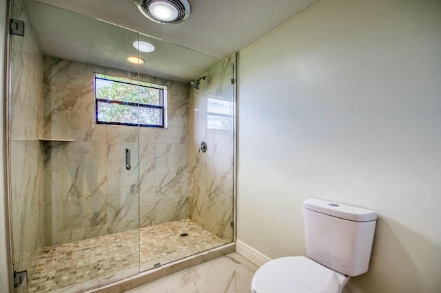 bathroom featuring walk in shower and toilet