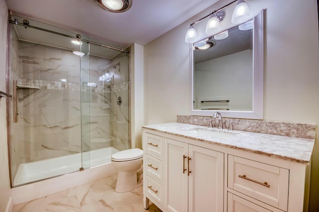 bathroom with vanity, toilet, and an enclosed shower