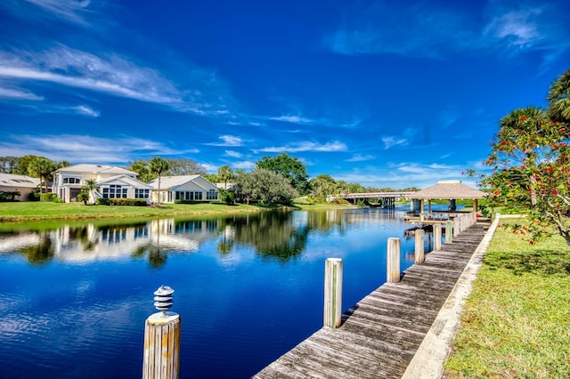 view of dock with a water view and a gazebo