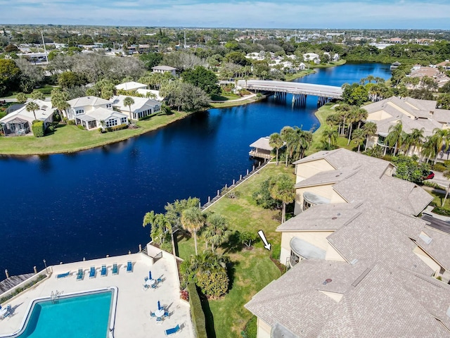 birds eye view of property with a water view