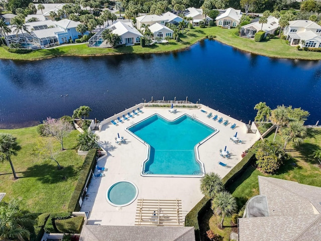 birds eye view of property with a water view