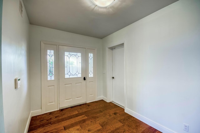 foyer featuring dark wood-type flooring