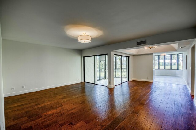 unfurnished room featuring wood-type flooring