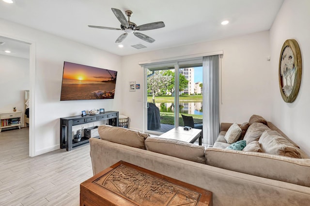 living room featuring ceiling fan