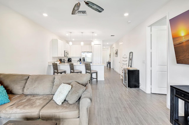 living room with ceiling fan