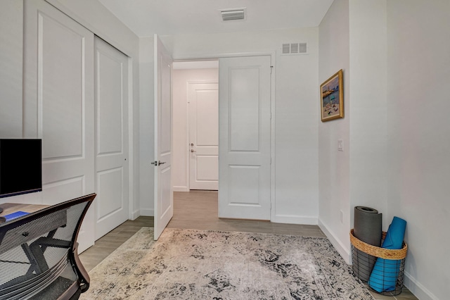 home office featuring light hardwood / wood-style floors