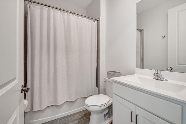 full bathroom featuring vanity, toilet, and shower / bath combo with shower curtain