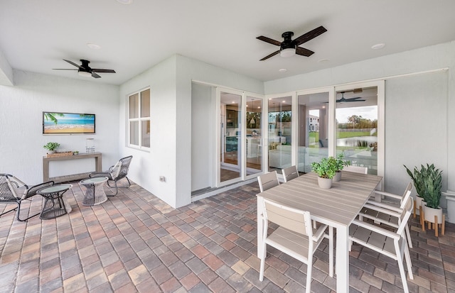 exterior space with ceiling fan