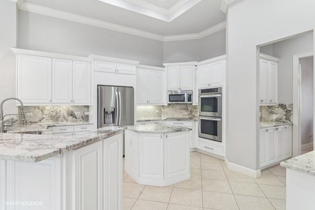 kitchen featuring sink, white cabinets, and appliances with stainless steel finishes