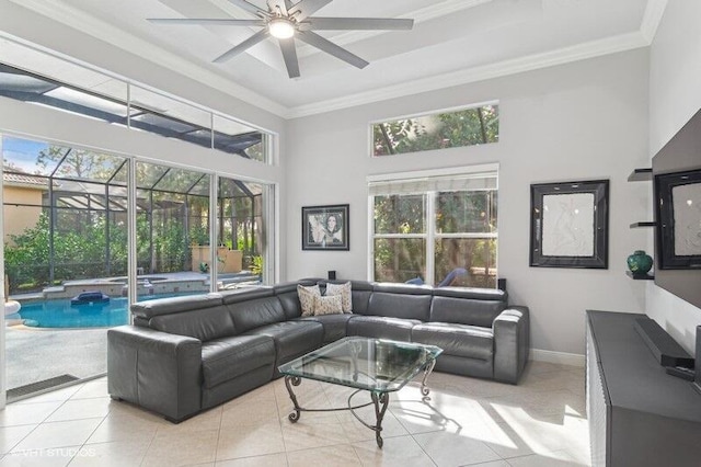 living room with light tile patterned floors, crown molding, a wealth of natural light, and ceiling fan