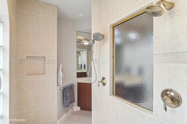 bathroom with tile patterned floors and tiled shower