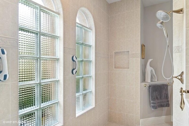 bathroom with a tile shower