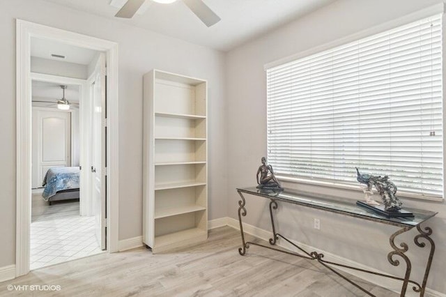 office space featuring ceiling fan and light hardwood / wood-style flooring