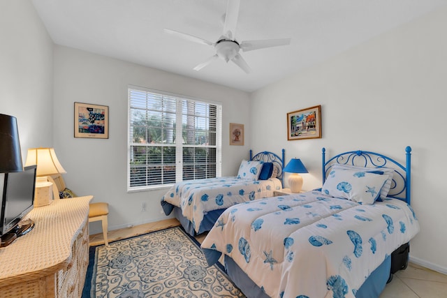 bedroom with light tile patterned flooring and ceiling fan