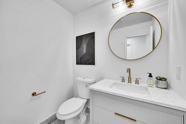 bathroom with toilet and vanity