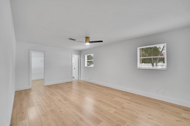 spare room with ceiling fan and light hardwood / wood-style flooring