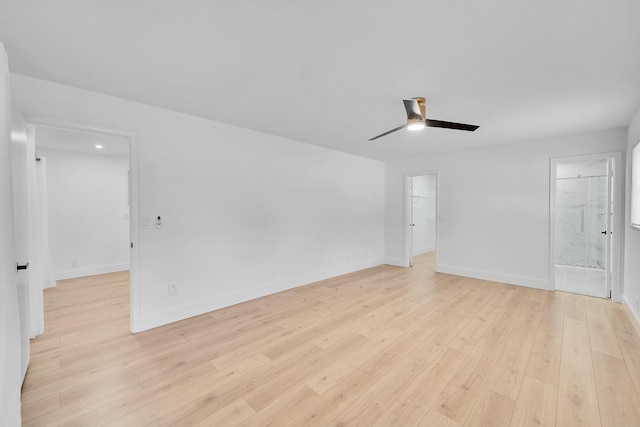 spare room featuring light wood-type flooring and ceiling fan