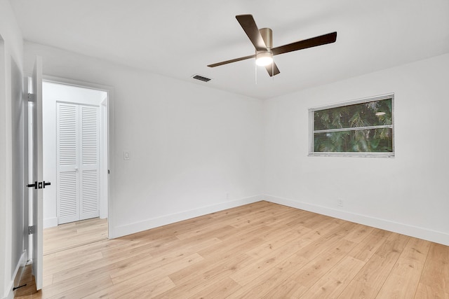 empty room featuring ceiling fan and light wood-type flooring