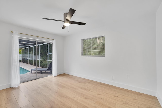 unfurnished room with light wood-type flooring and ceiling fan