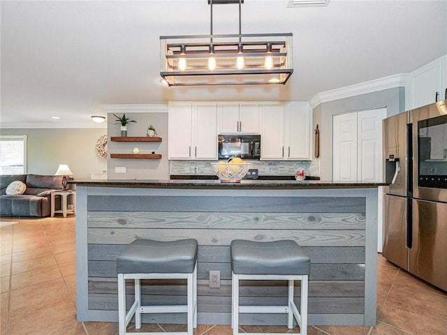 kitchen featuring stainless steel fridge with ice dispenser, crown molding, pendant lighting, and white cabinets